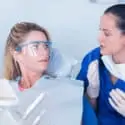 dentist explains to patient